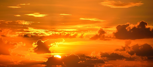 Vibrant Miami sunset over a calm bay with city lights beginning to twinkle (sunset miami)