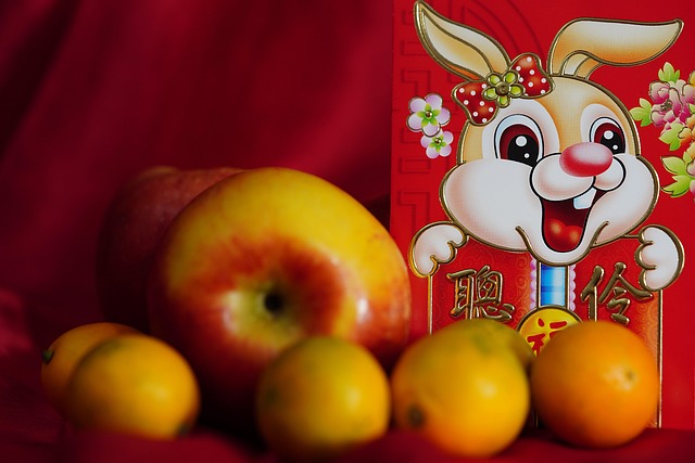 Apples, small oranges, and a Chinese New Year rabbit red envelope